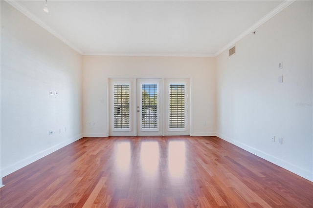 630 Vassar St Unit 2310, Orlando, FL 32804 - empty room featuring ornamental molding and light hardwood / wood-style floors