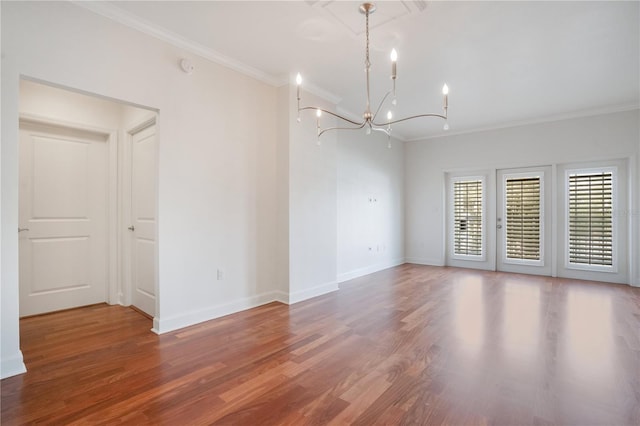 630 Vassar St Unit 2310, Orlando, FL 32804 - unfurnished room featuring hardwood / wood-style flooring, ornamental molding, and a chandelier