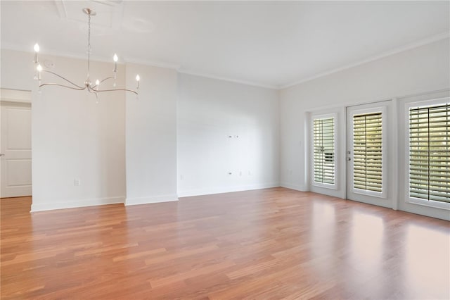 630 Vassar St Unit 2310, Orlando, FL 32804 - unfurnished room with ornamental molding, a chandelier, and light wood-type flooring