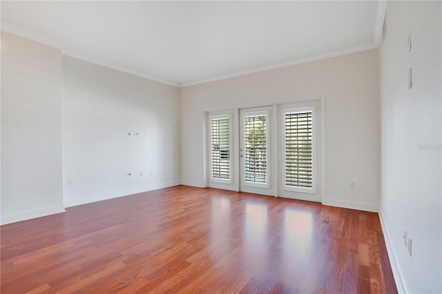630 Vassar St Unit 2310, Orlando, FL 32804 - empty room featuring hardwood / wood-style flooring, ornamental molding, and french doors