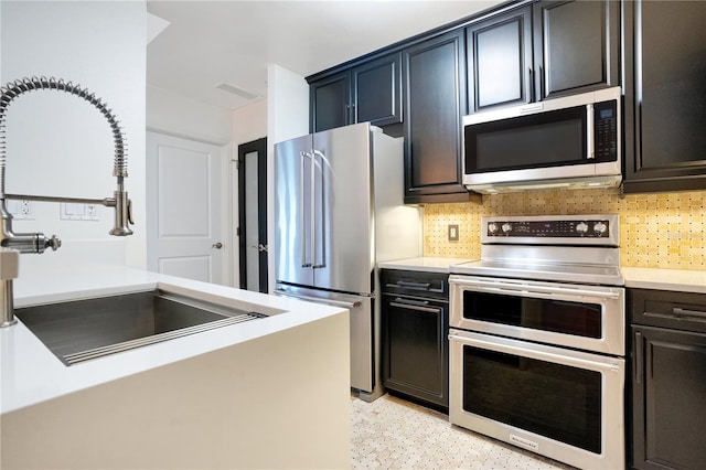 630 Vassar St Unit 2310, Orlando, FL 32804 - kitchen featuring appliances with stainless steel finishes, sink, and backsplash