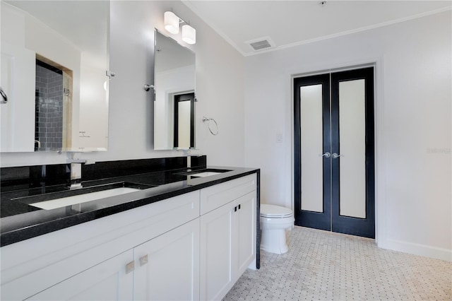 630 Vassar St Unit 2310, Orlando, FL 32804 - bathroom with vanity, ornamental molding, and toilet