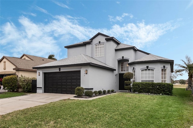 view of front facade with a front yard and a garage