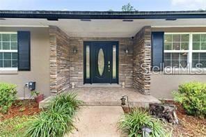 property entrance featuring covered porch