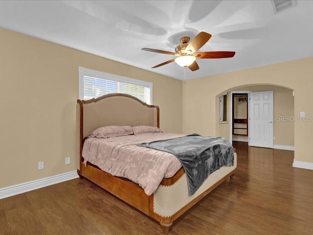 bedroom featuring dark wood-type flooring and ceiling fan