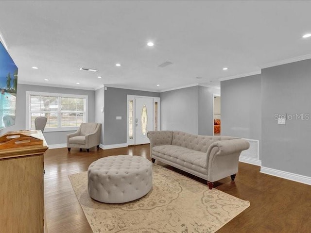 living room with ornamental molding and hardwood / wood-style floors