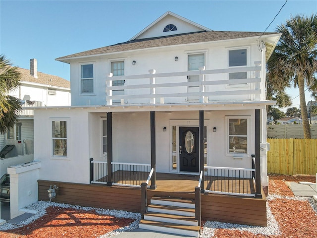 view of front facade featuring a porch and a balcony