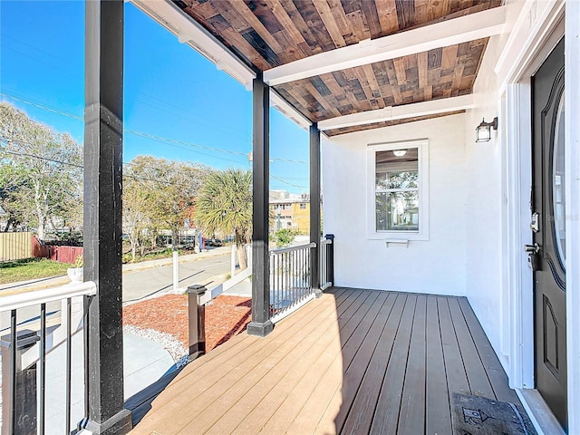 wooden terrace featuring a porch