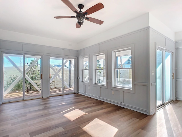 interior space featuring hardwood / wood-style floors and ceiling fan