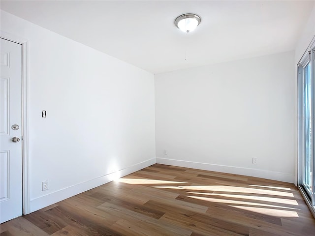 unfurnished room featuring wood-type flooring