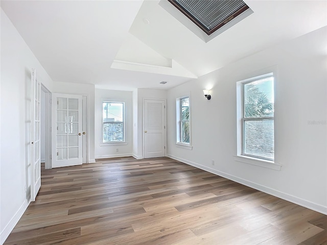 empty room with hardwood / wood-style flooring