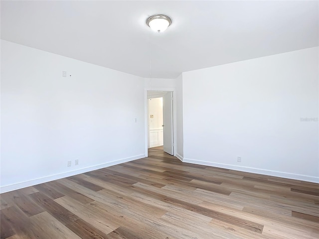 unfurnished room featuring hardwood / wood-style floors