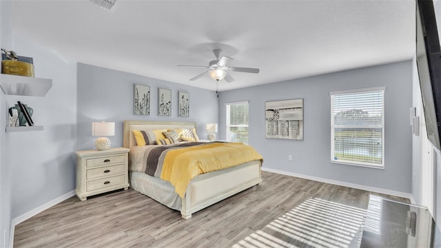 bedroom featuring ceiling fan and light wood-type flooring