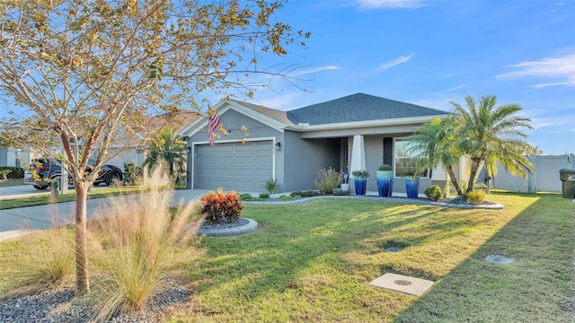 view of front of house with a garage and a front lawn