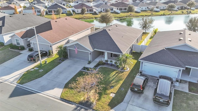 birds eye view of property with a water view