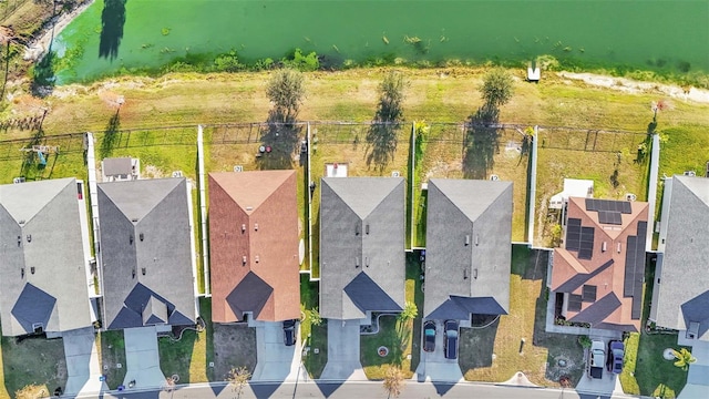 bird's eye view with a water view