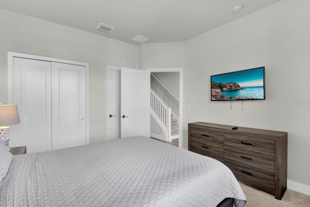 bedroom featuring light carpet