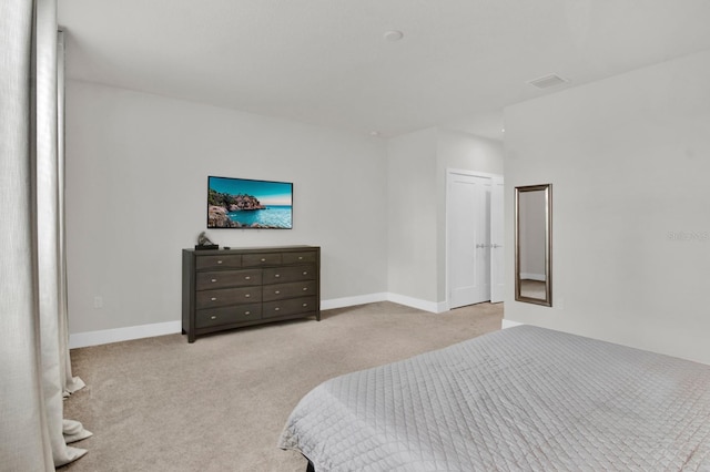 bedroom with light carpet