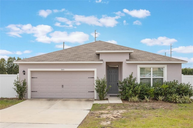 view of front of property with a garage