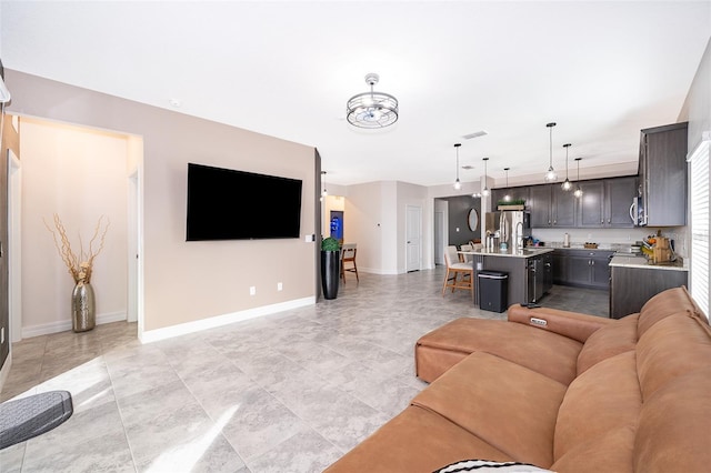 living room with a notable chandelier