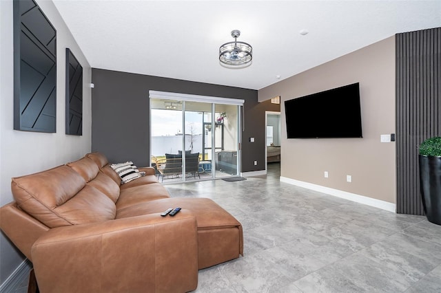 living room featuring a notable chandelier