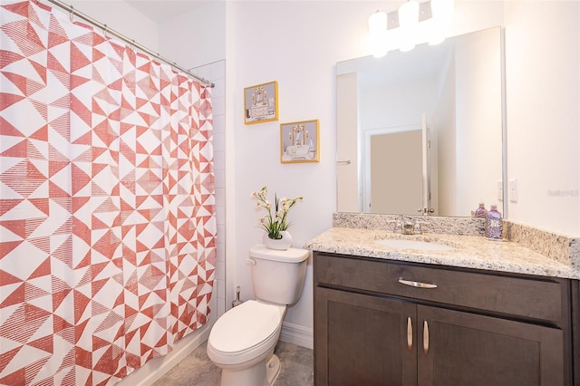 bathroom with toilet and vanity