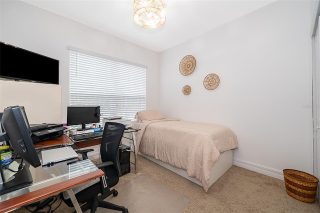 bedroom with light colored carpet