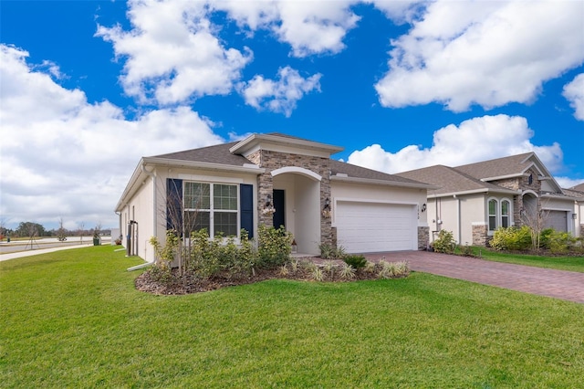 view of front of property featuring a front lawn and a garage