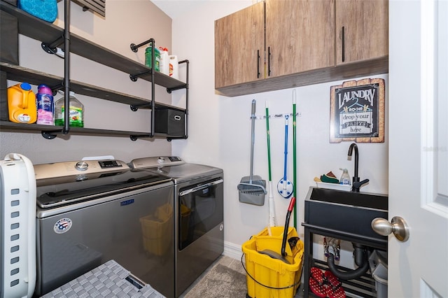 clothes washing area with washer and dryer