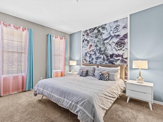 carpeted bedroom featuring multiple windows