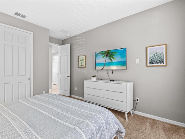 bedroom with light colored carpet