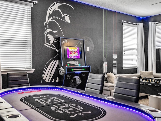 playroom with a textured ceiling