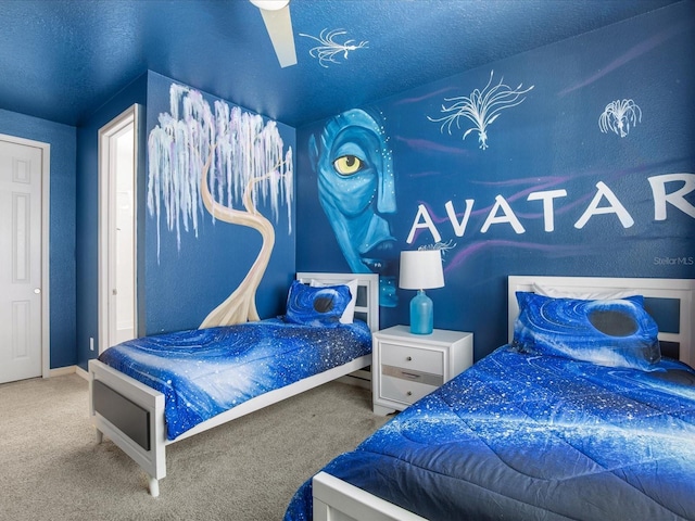 bedroom featuring ceiling fan and carpet