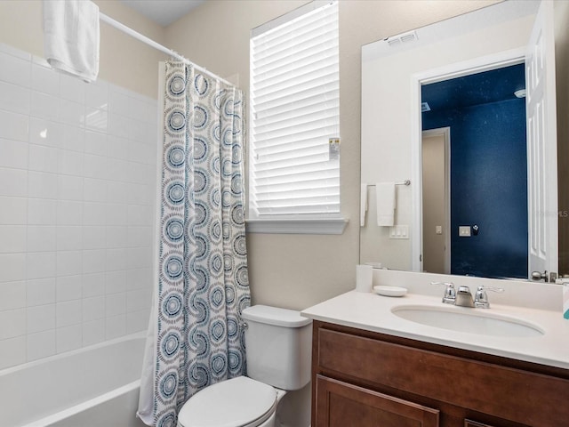 full bathroom with shower / bath combo with shower curtain, vanity, and toilet