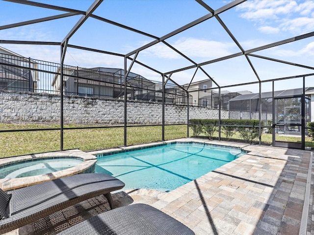 view of swimming pool featuring a patio, glass enclosure, and an in ground hot tub