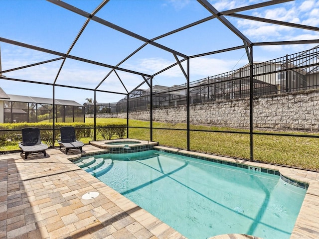 view of swimming pool with a lanai, an in ground hot tub, and a patio area