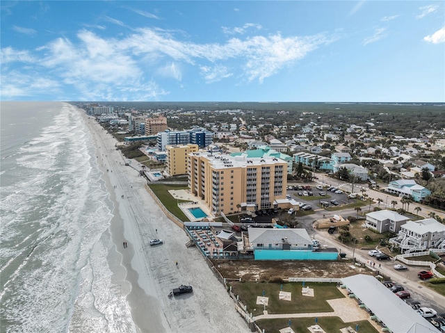 birds eye view of property featuring a water view and a view of the beach