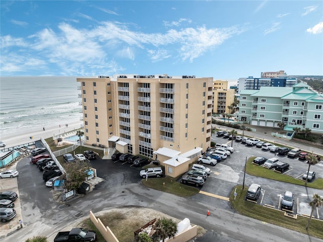 view of property featuring a water view and a view of the beach