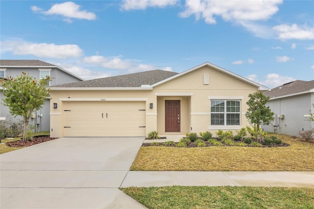 view of front of house featuring a garage and a front yard