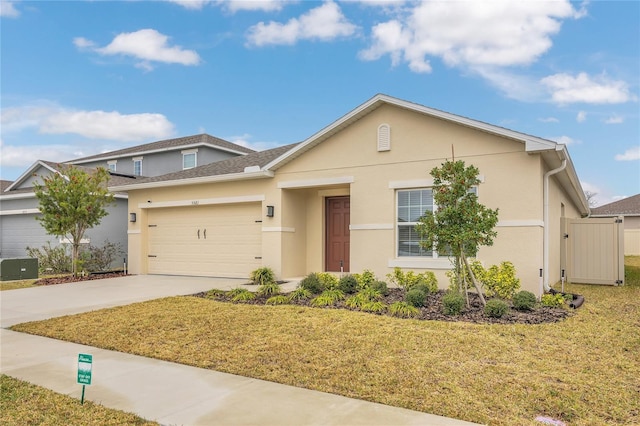 view of front of house featuring a garage, a front yard, and central air condition unit