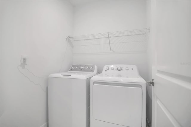 laundry room with washer and dryer