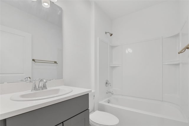 full bathroom with vanity, shower / tub combination, and toilet