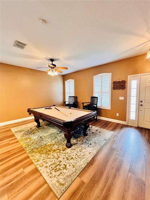 recreation room with ceiling fan, hardwood / wood-style floors, and pool table