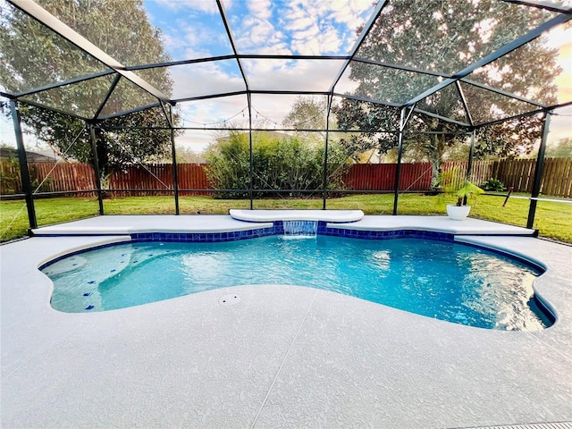 view of swimming pool with a lanai, a yard, and a patio