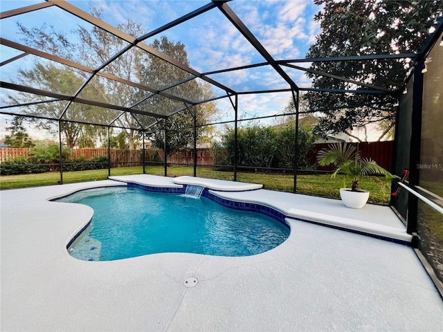 view of swimming pool featuring a lanai, a patio area, and a yard