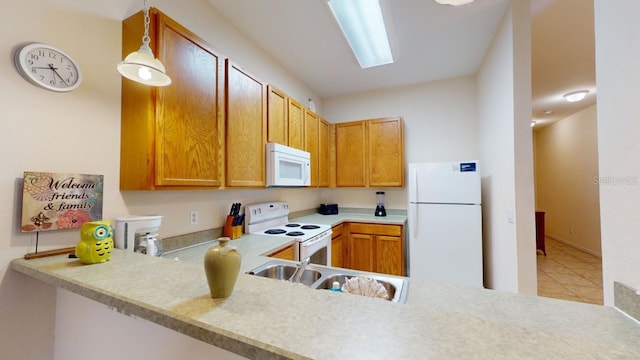 kitchen with sink, hanging light fixtures, kitchen peninsula, white appliances, and light tile patterned flooring