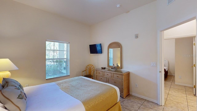 bedroom featuring light tile patterned floors