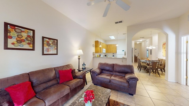 tiled living room featuring ceiling fan