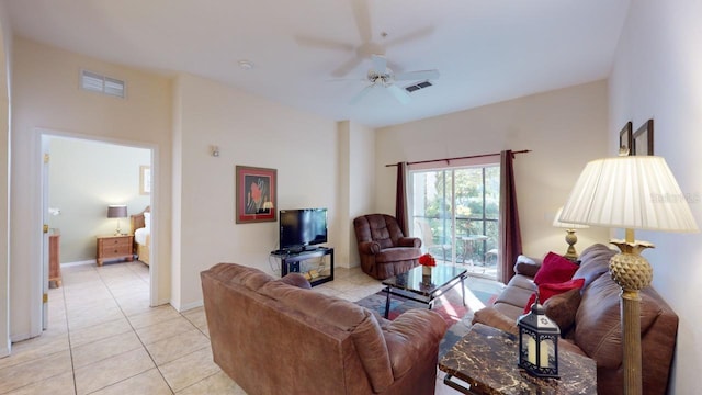 living room featuring ceiling fan and light tile patterned flooring