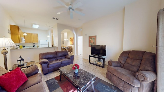 tiled living room featuring ceiling fan